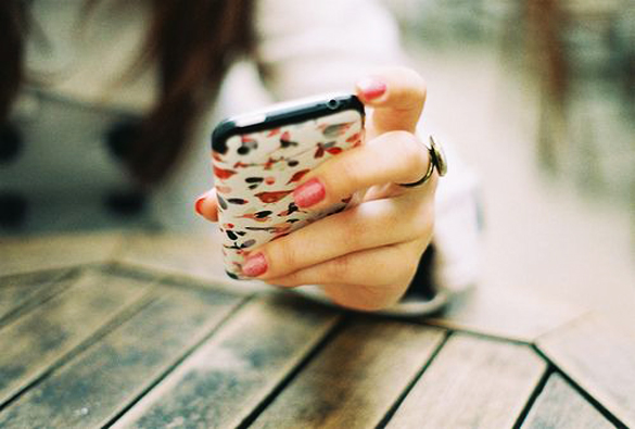 woman-hand-holding-a-cell-phone